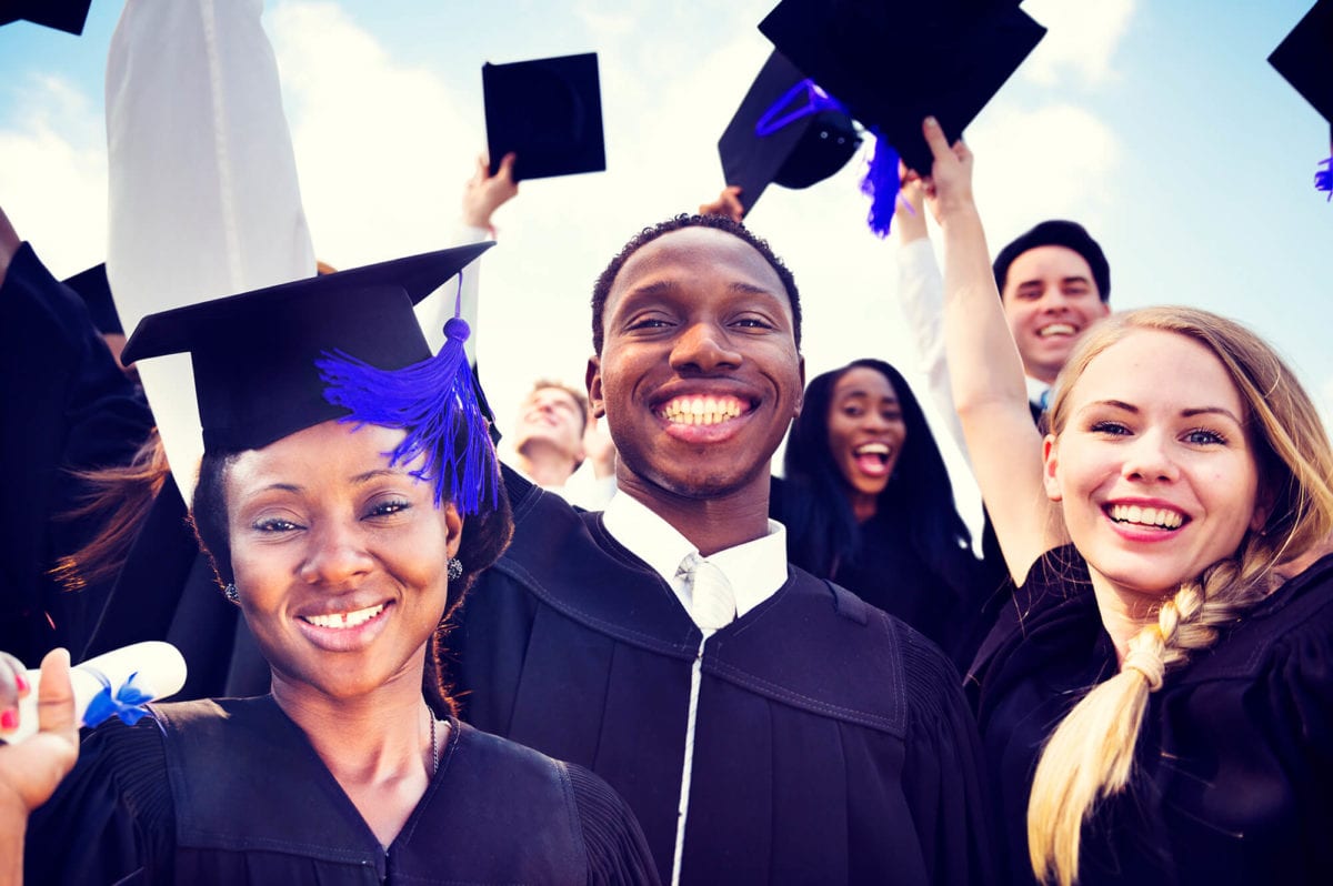 College students smile after graduation