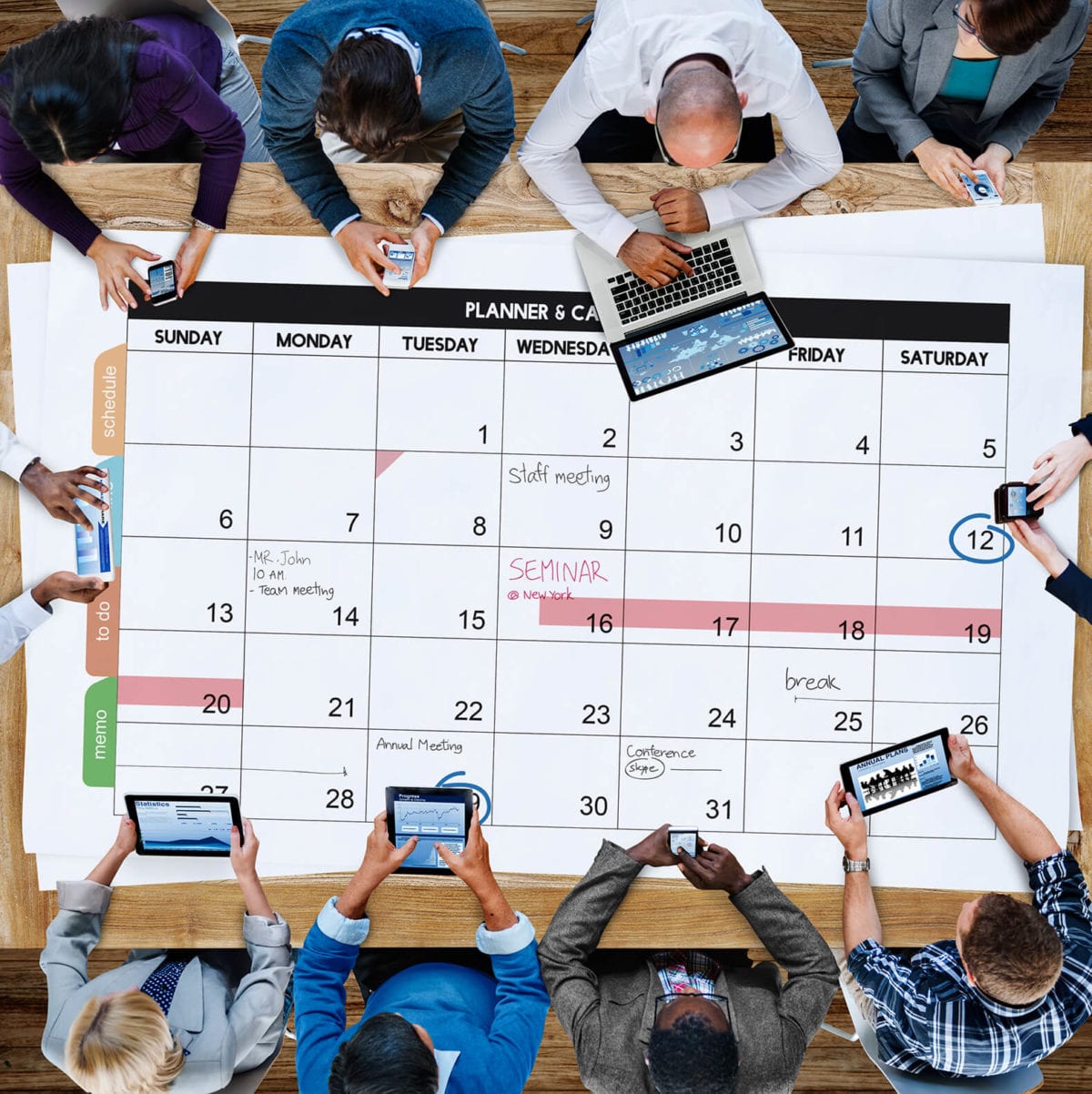 Employees work on large calendar